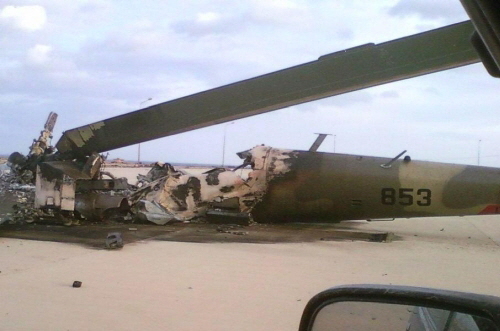 The burnt-out wreckage of a Mi-35  Hind-E  combat helicopter from the 1335th Squadron at Benina Airport in 2011.