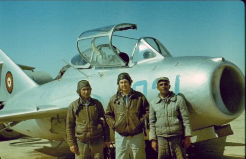 Soviet advisor and two Afghan soldier in front of a 393rd Training Air Regiment s MiG-15UTI  Midget  in 1981. 