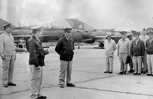 Regiments crew lined-up in Bagram. In  the background MiG-21UM Mongol-Bs.