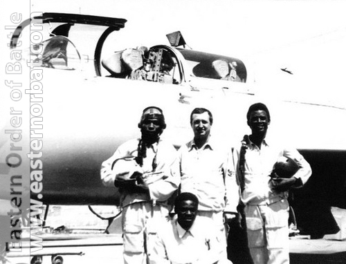 Congolese pilots and their soviet instructor in front of silver color MiG-21UM Mongol-B. Photo: Valery Okheretko