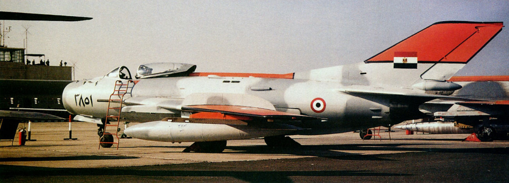 EAF Shenyang F-6 in the nineties. It displays black-edged yellow identification panels on its tail-fin, fuselage spine and wingtips.