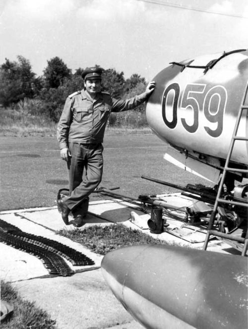 Colonel Janos Holler the 101st Reconnaissance Air Regiment commander next to his MiG-15bis Fagot-B aircraft