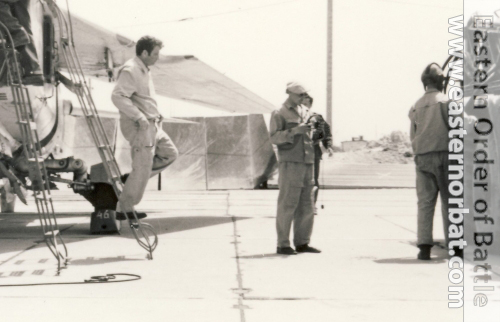 Soviet pilot and ground crews crews next to theirs MiG-23UB Flogger-C training aircraft in Lugovaya in 1979.