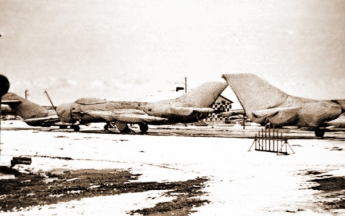 Soviet MiG-19 Farmer interceptors and MiG-17 Fresco trainer aircraft at Afrikanda airport in winter